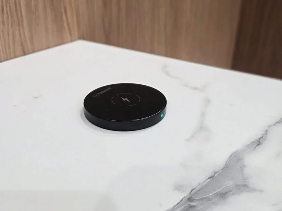 SwiftPro charger on a white stone table in a venue